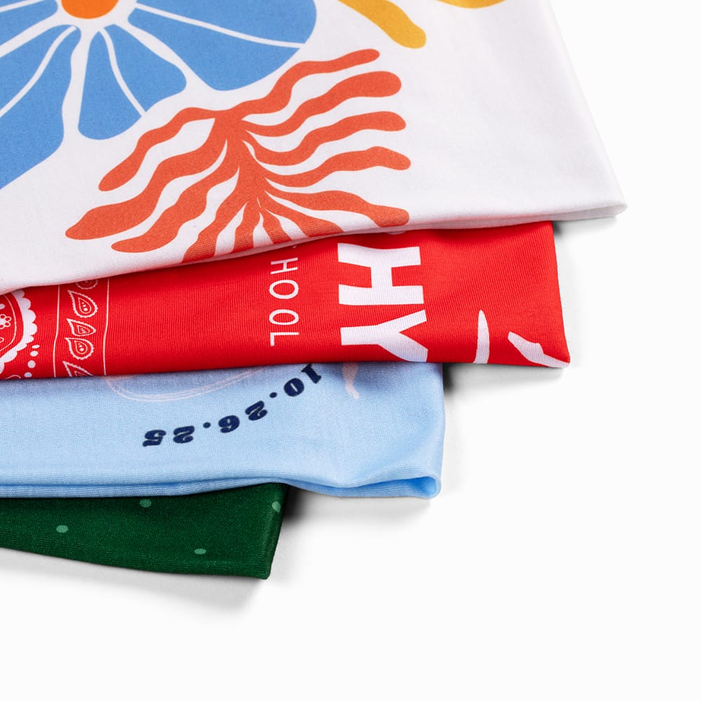 Stack of folded custom bandanas