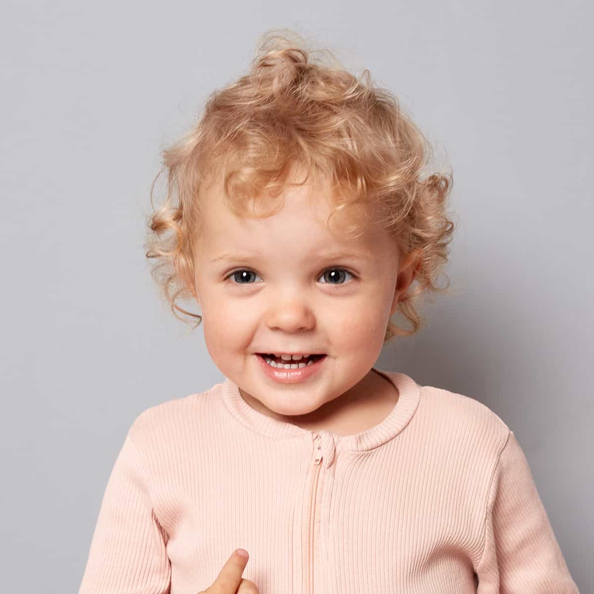 Toddler facing the camera with nothing in front of the face