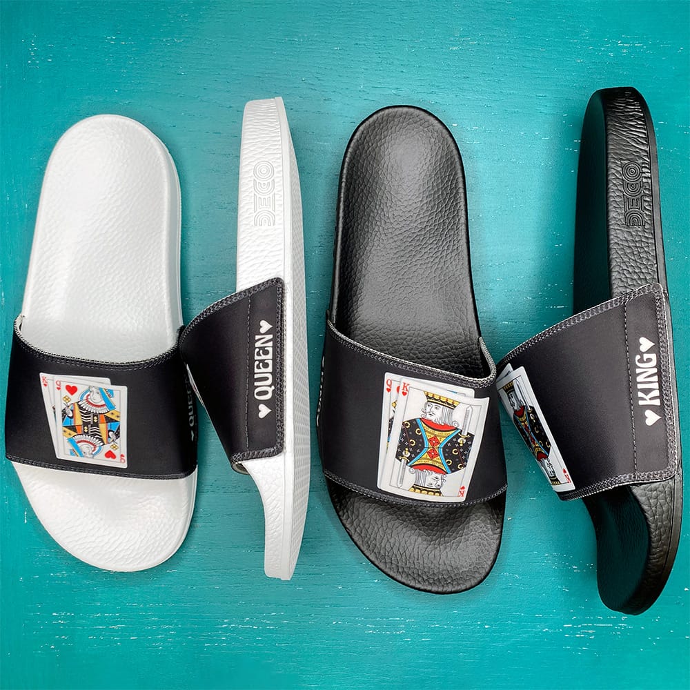 White and black custom slides with playing-card art, personalized Queen and King on the straps