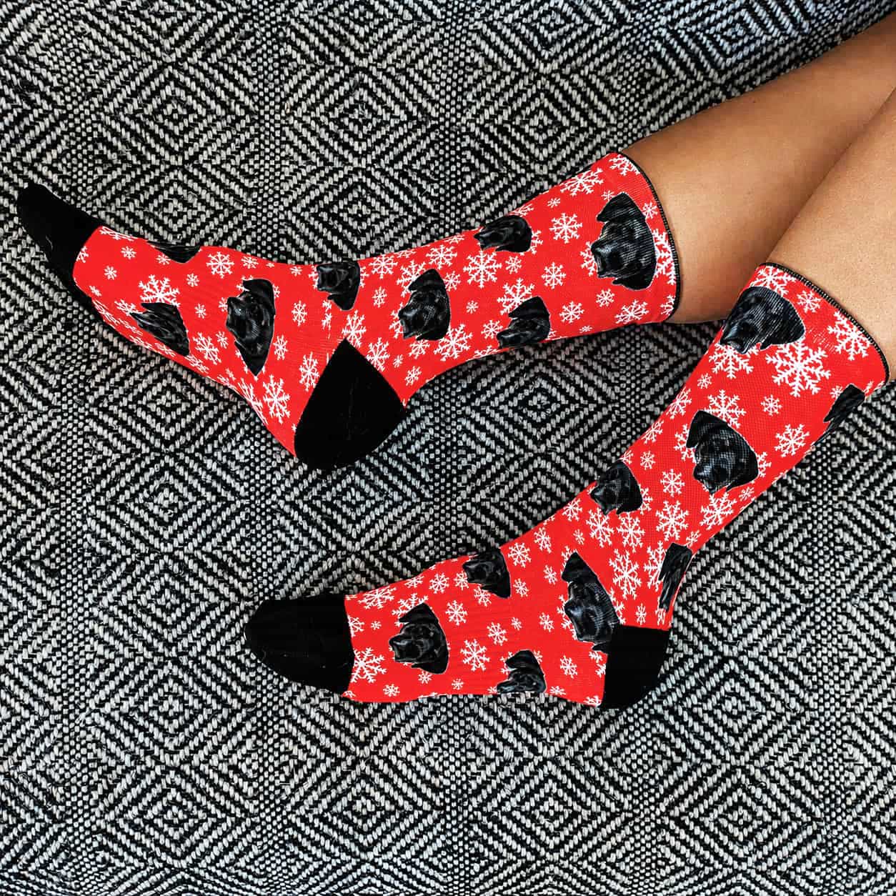 Custom printed crew socks with a dog's face and snowflake pattern